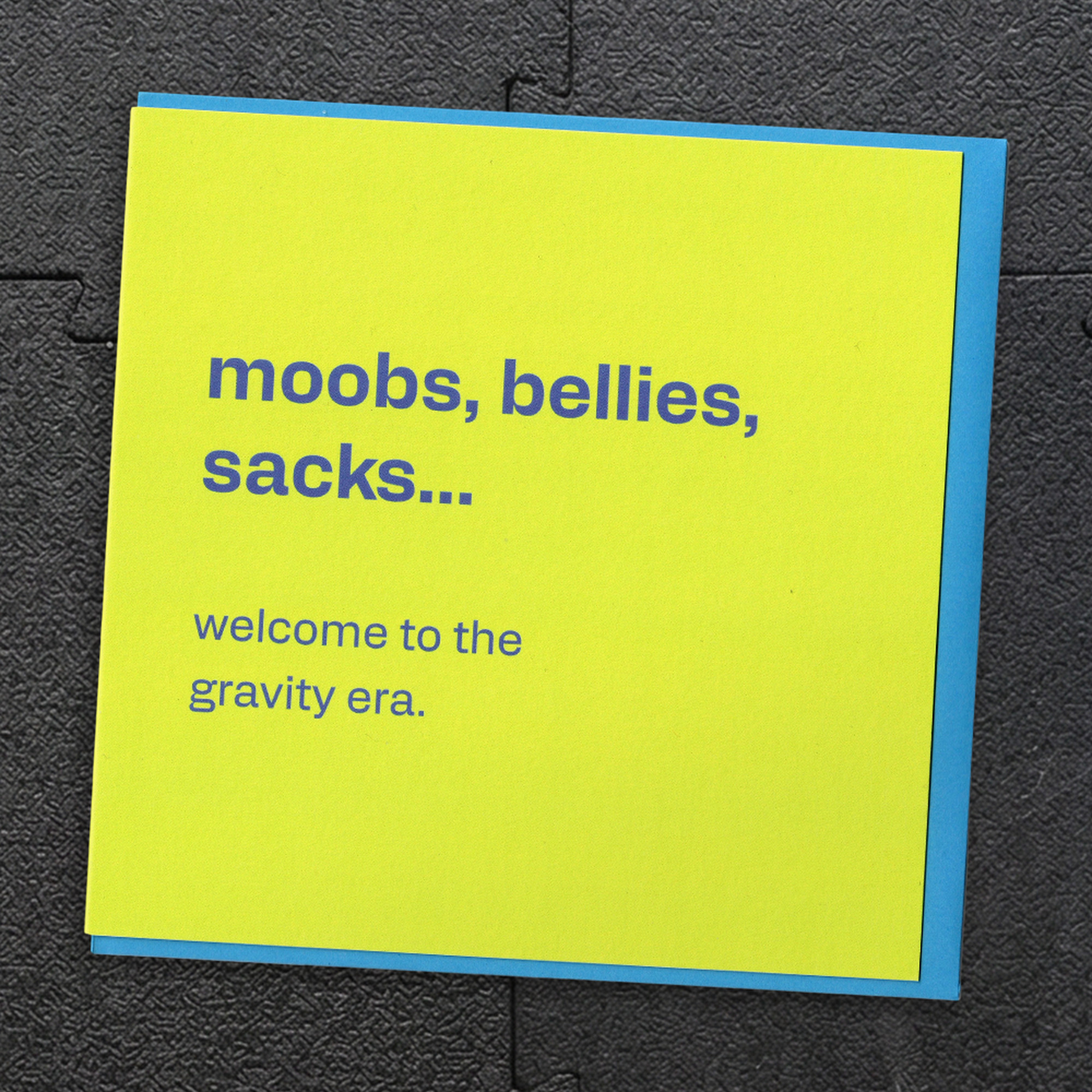 Moobs, Bellies, Sacks… Welcome to the Gravity Era - Funny Birthday Card for Him, in a real setting.