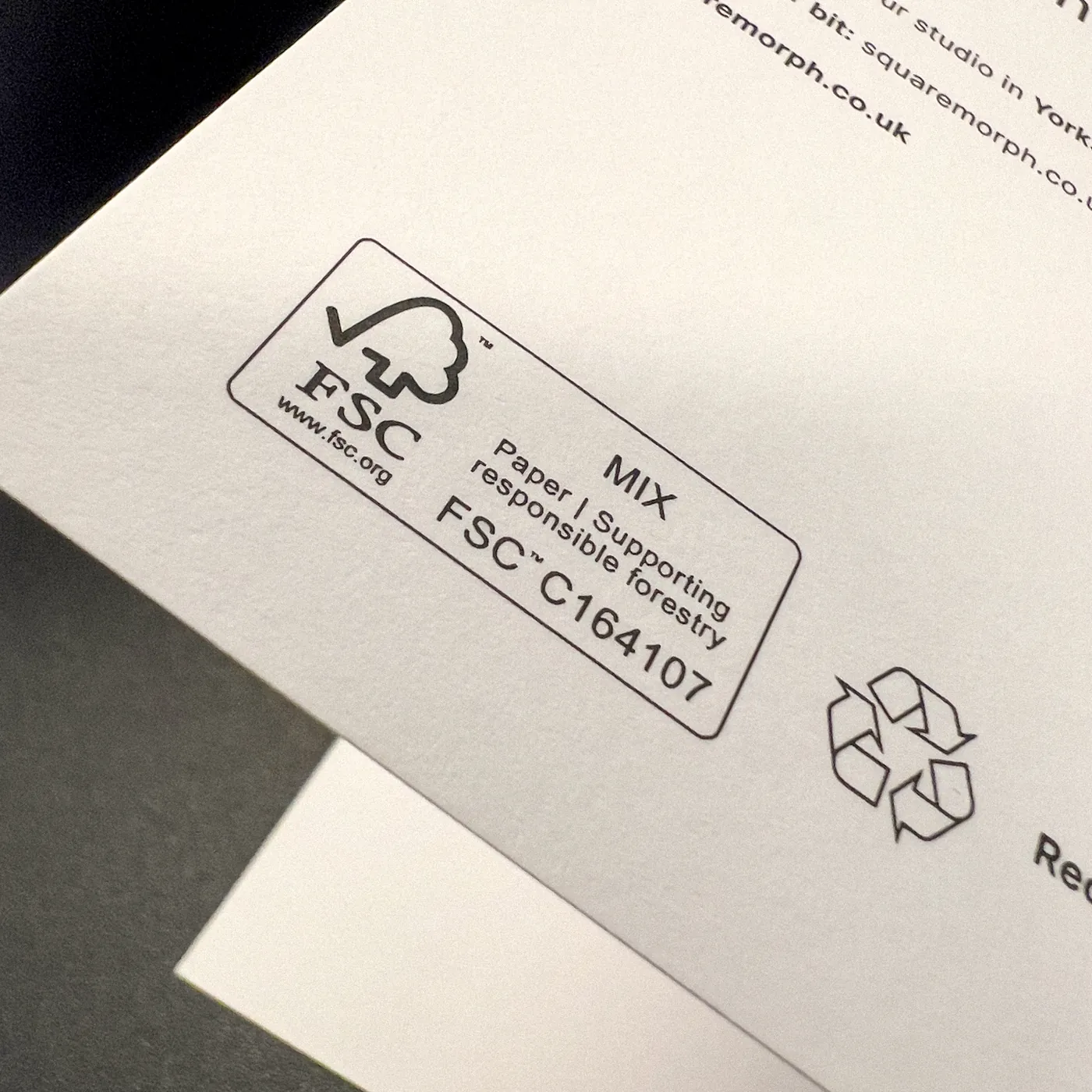 A close-up of the FSC certification mark printed on the back of a SquareMorph card.
