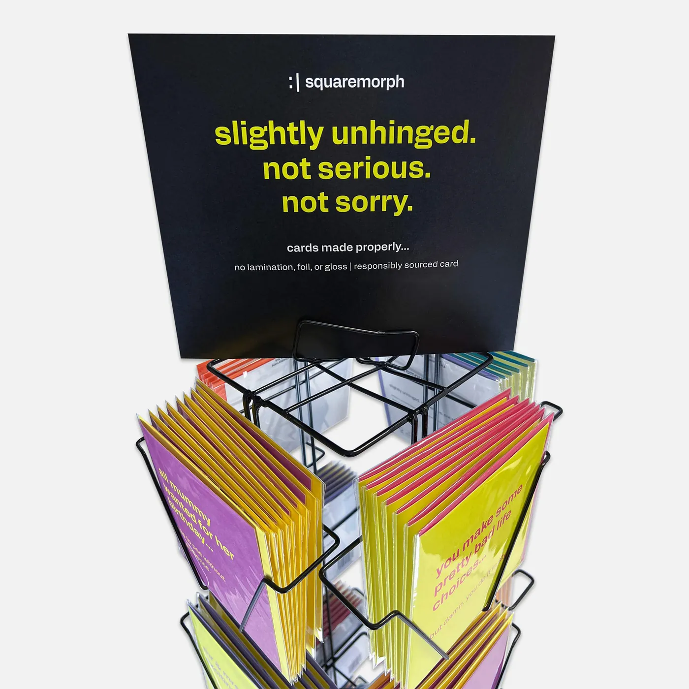 A SquareMorph spinner stand filled with cards, as supplied to stockists.